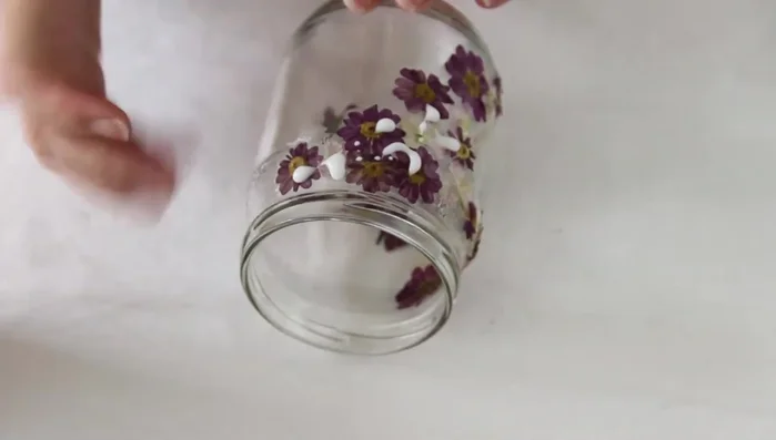 Let the glue dry for a couple of hours. Then, apply a second coat of Mod Podge or craft glue to seal the flowers and protect them from moisture.