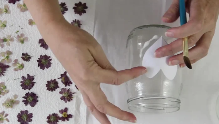 Once the area around the heart is covered, remove the paper template.