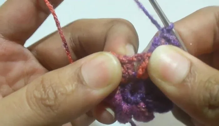 Continue working in this pattern (alternating one and two popcorn stitches) for subsequent rounds until desired necklace length is reached. Always add chain one after each popcorn stitch.