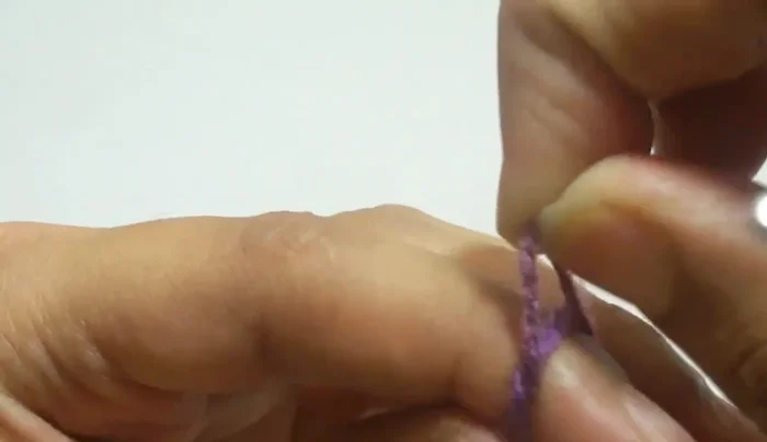 Chain three, then work four double crochet in the same stitch. Pull through two loops twice.