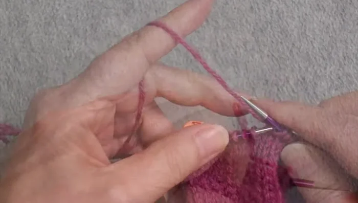 Separate Thumb Stitches: Once the gusset is complete, place the thumb stitches onto a waste yarn or stitch holder.