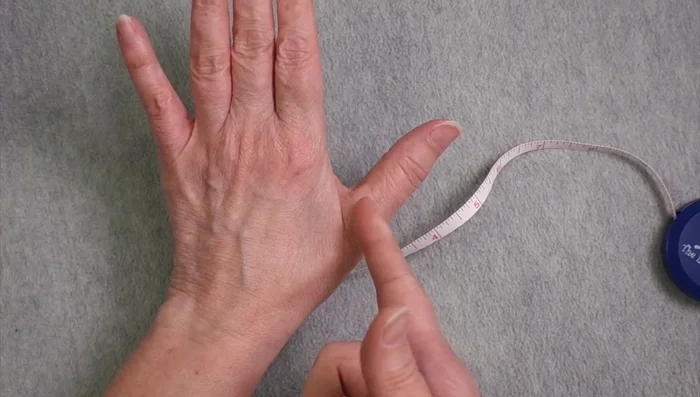 Calculate Cast-on Stitches: Multiply hand circumference (in inches) by gauge (stitches per inch) to determine the approximate number of stitches needed. Round up to the nearest multiple of four for ribbing.