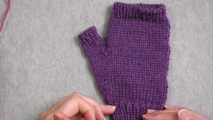 Separate Thumb Stitches: Once the gusset is complete, place the thumb stitches onto a waste yarn or stitch holder.