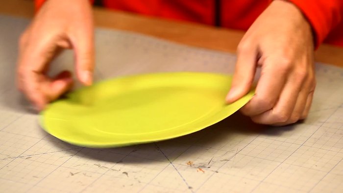 Fold the plate and cut it in two.