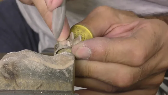 Use a half-round ring file to refine the crease without creating flat spots.