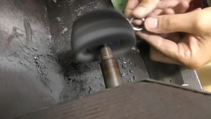 Carefully file the setting to avoid compromising the stone's integrity.