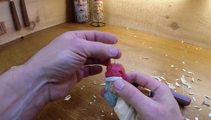 Attach a hanger: Attach an eyescrew and wire for hanging the ornament.