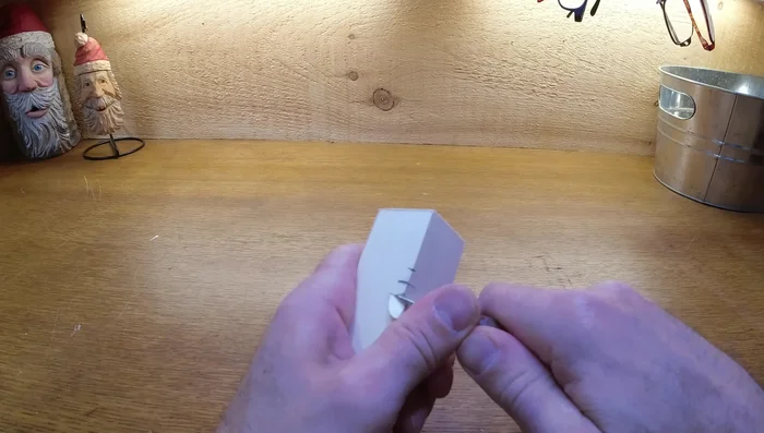 Shape the face: Add angles to the nose, cutting away from the center. Clean up the edges, avoiding thin edges that can break easily.