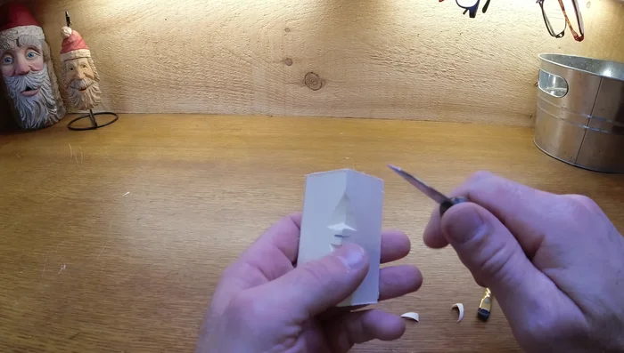 Shape the face: Add angles to the nose, cutting away from the center. Clean up the edges, avoiding thin edges that can break easily.