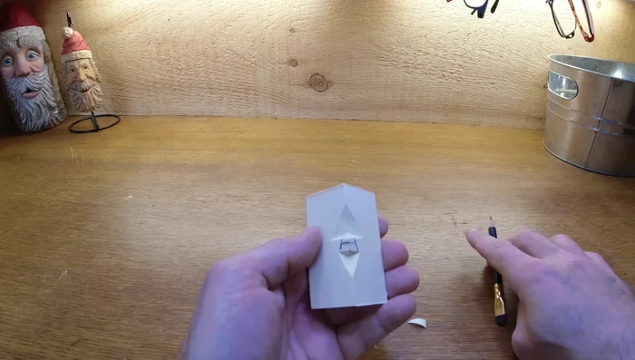 Shape the face: Add angles to the nose, cutting away from the center. Clean up the edges, avoiding thin edges that can break easily.