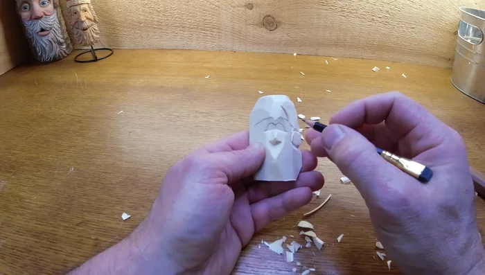 Carve the hair and beard: Create the hair and beard with simple cuts, avoiding sharp edges.