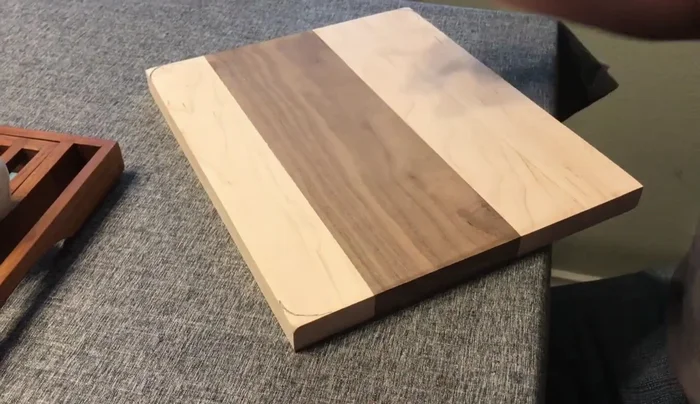 Round the edges using a router with a round-over bit.