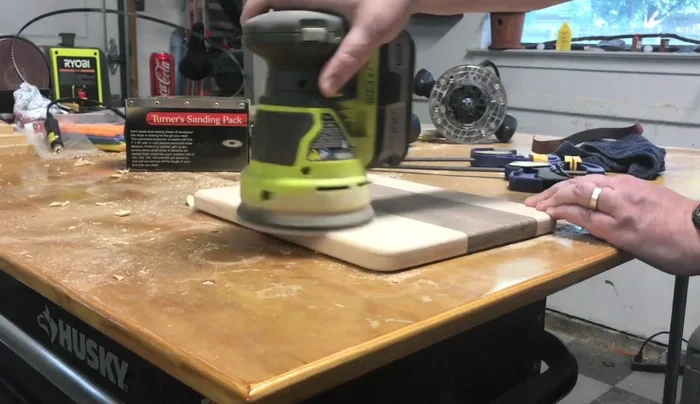 Sand the board using sandpaper of various grits (80-220).
