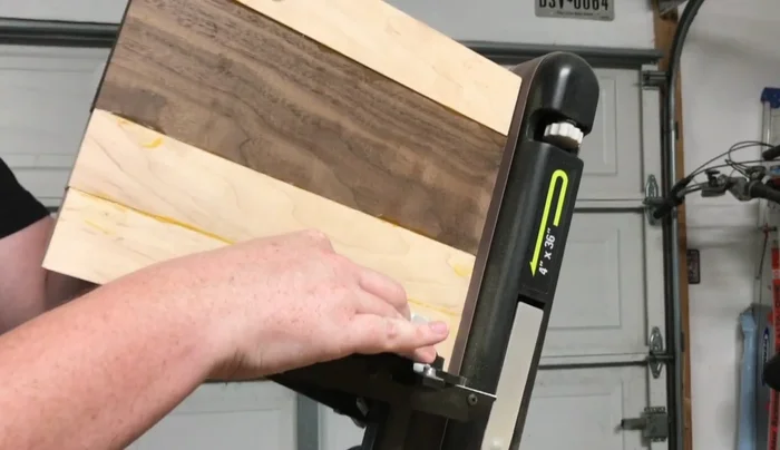 Square up the edges using a belt sander.