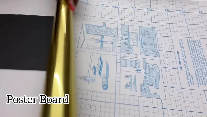 Cover the sides of the structure with gold contact paper and use strong adhesive and hot glue to secure the top foam board.