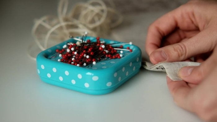 Prepare fabric pieces: Cut two main details (one printed, one plain), two cap details (one printed, one plain), and pocket details according to the measurements shown on screen. The pockets are double-layered.