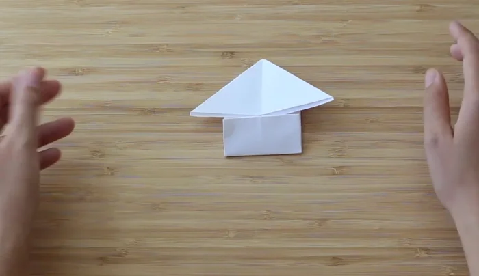 Make the legs skinnier by folding them at an angle outward.