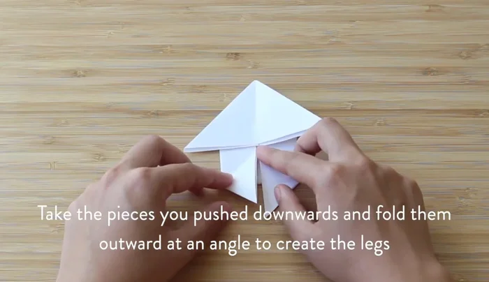 Make the legs skinnier by folding them at an angle outward.
