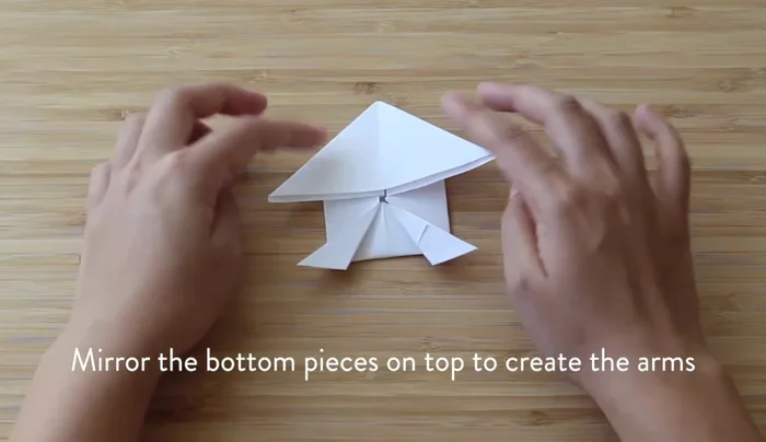 Create the arms similarly to the legs, folding them up and outward.