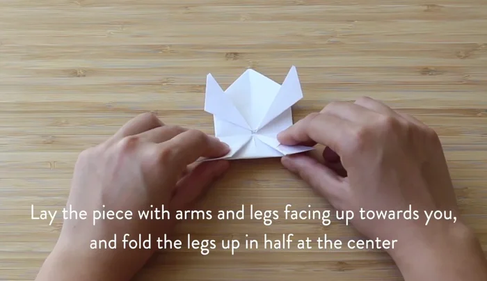 Fold the legs backwards like an accordion, creating a crease.