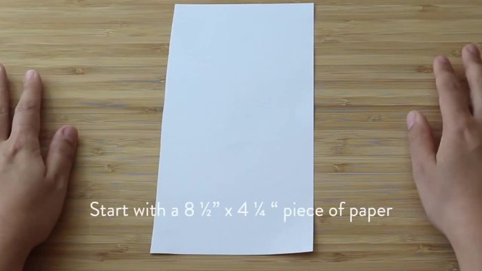 Fold the paper in half horizontally, then open it to reveal a horizontal line through the X.