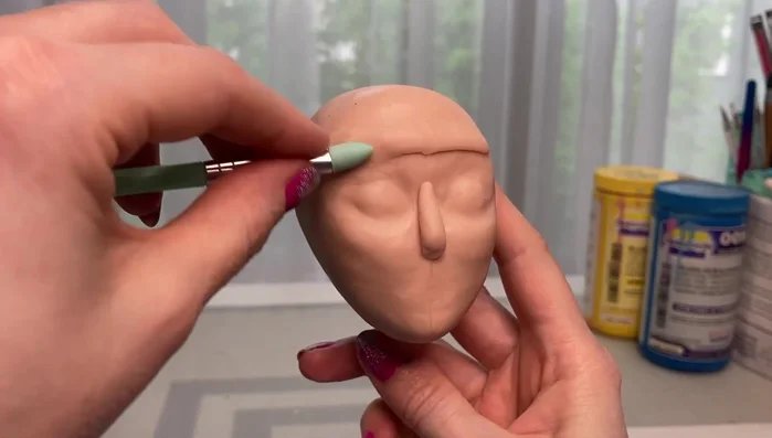 Build up the brow bone area with clay.