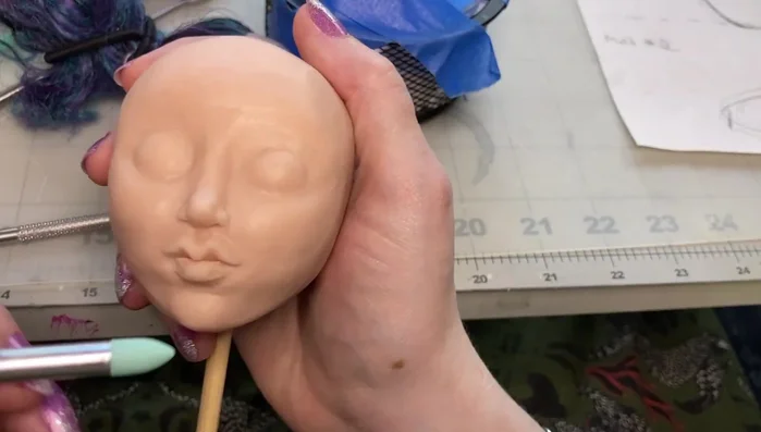 Carve out the jawline to achieve the desired shape.