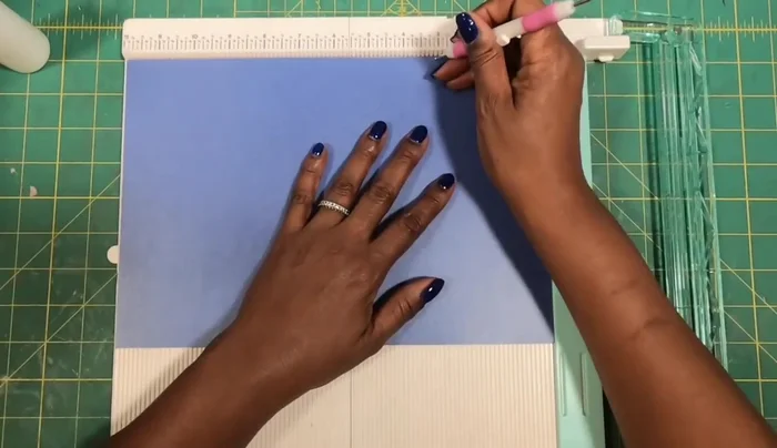 Assemble the Purse Body: Glue and assemble the two larger cardstock pieces, creating the main structure of the purse. Trim excess tabs as shown.