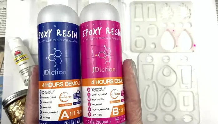 Add gold foil to the clear resin, ensuring even distribution.