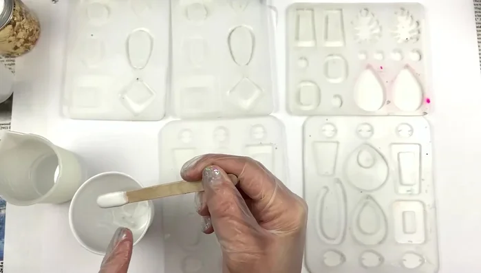 Add gold foil to the clear resin, ensuring even distribution.