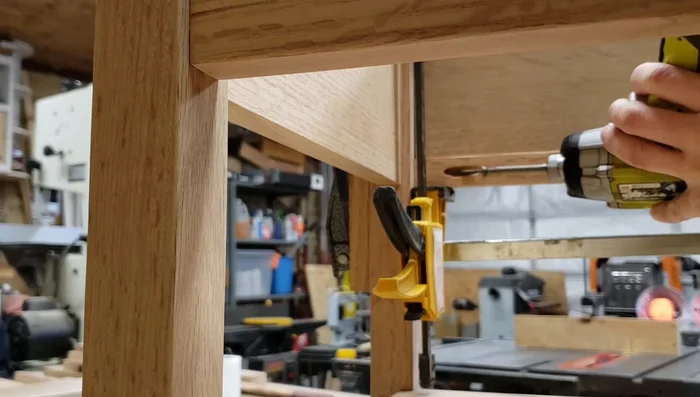 Installing drawer runners.