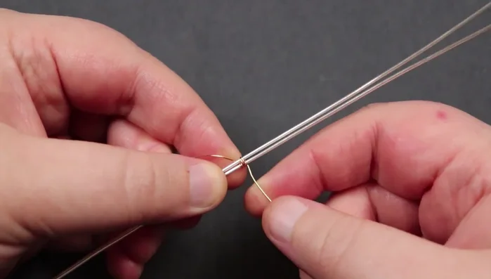 Create pyramids: Create three pyramids on each side, using the weaving wire to create a small pyramid shape with each section of two wraps. Make sure to maintain loose spacing between the base wires.