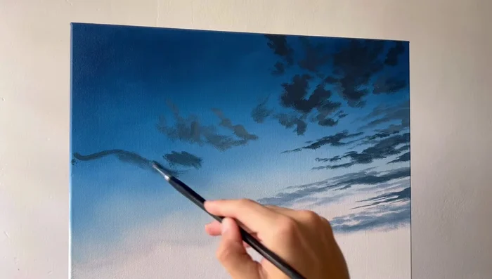 Add subsequent layers of similar colors to blend brush strokes and create a smoother effect. Use a dry blending brush for smooth transitions.