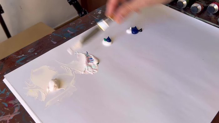 Mix acrylic paint colors for the sky, from lightest to darkest.