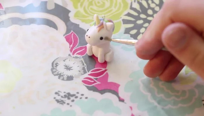 Add blush: Use pink chalk pastels to add blush to the cheeks.