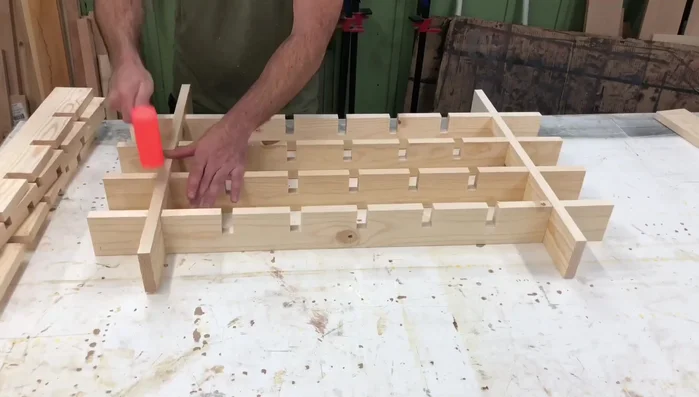 Apply wood glue to the joints, assemble the shelf, and clamp if necessary.