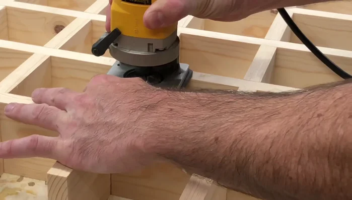 Use a chamfer bit to round the edges.