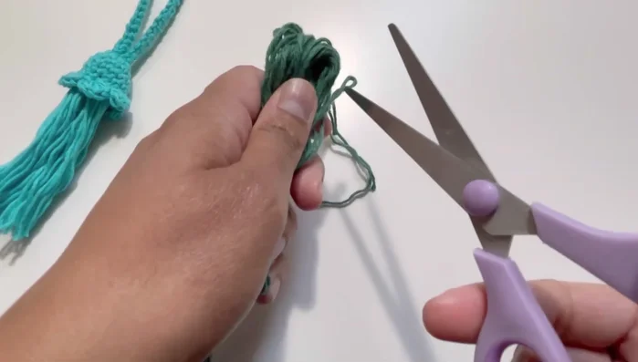 Weave in the ends and trim the tassel to your desired length.