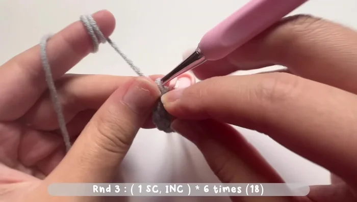 Round 3: Increase stitch (two single crochets in one stitch) after one single crochet. Repeat six times. Total of 18 single crochets.