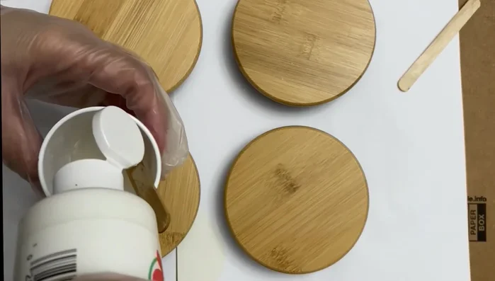 Add color and glitter: Incorporate acrylic paint (white and gray) and glitter directly into the mixed epoxy resin. Mix until well combined.