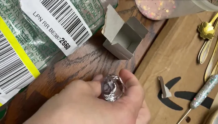 Cover edges (optional): Apply a decorative strip (chrome strip in this case) to cover the drilled area around the handle, using hot glue or E6000 to secure.