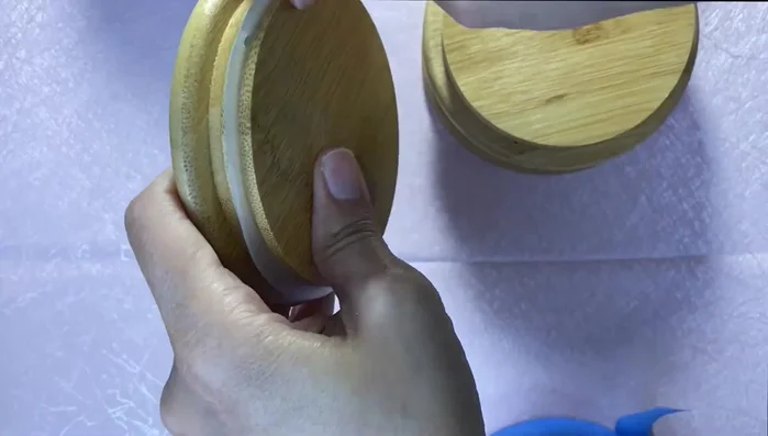 Prepare the canisters: Remove plastic airtight parts and protect the bottom of the lids with blue tape.