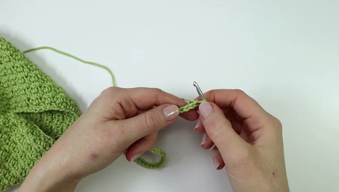Make straps: Chain 37, single crochet in each stitch across. Attach to the lining with slip stitches. Repeat rows until you have 6 rows total.