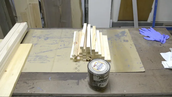 Apply stain, using tape to mask off 1.5 inches on either end of slats to allow for glue penetration during assembly.