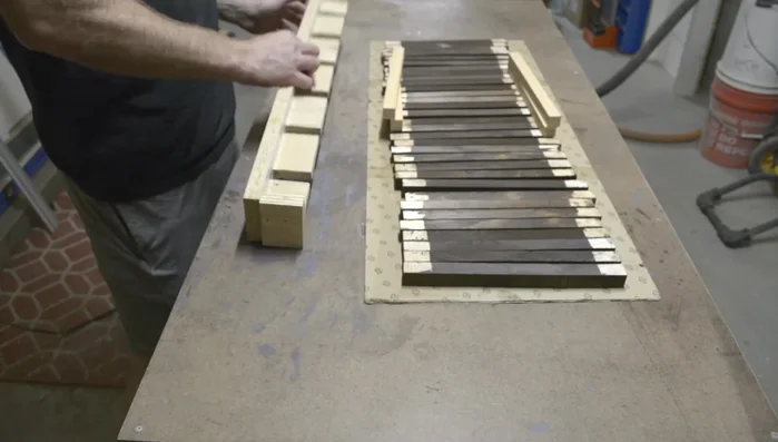 Assemble the towers: Attach slats to legs using glue and finish nails, using a jig for consistency (optional).