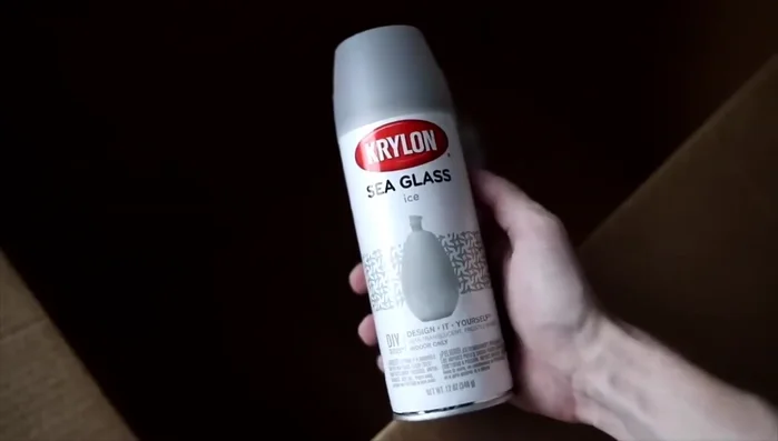 Spray paint the vase with Krylon sea glass spray paint (or similar). It is suggested to protect the inside of the vase and use a mask on yourself for better protection.