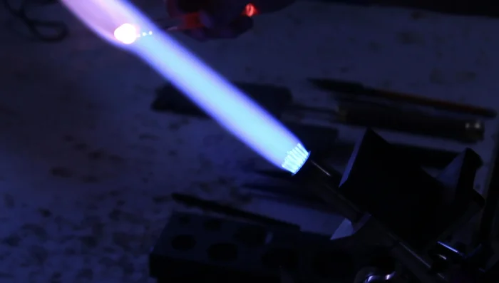 Heat and melt the marbles together using one hand to prevent image distortion.