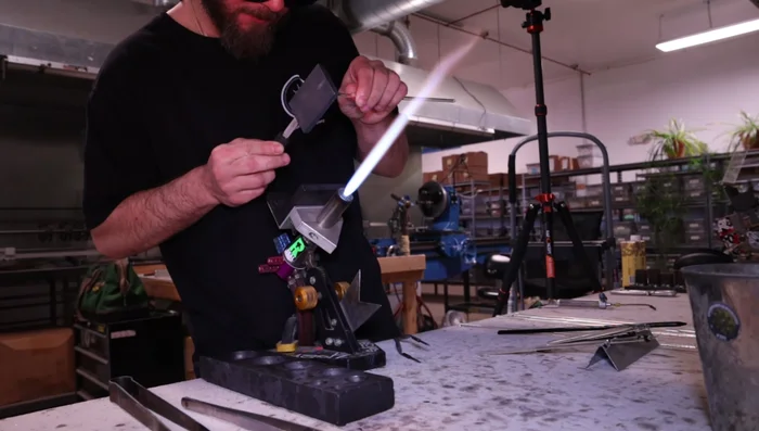 Create a flat back for the pendant, using gravity to help shape it.