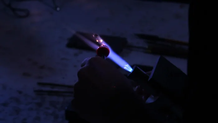 Use gravity to flatten the front of the pendant, preserving a round concave image.