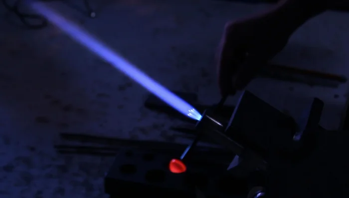 Use gravity to flatten the front of the pendant, preserving a round concave image.